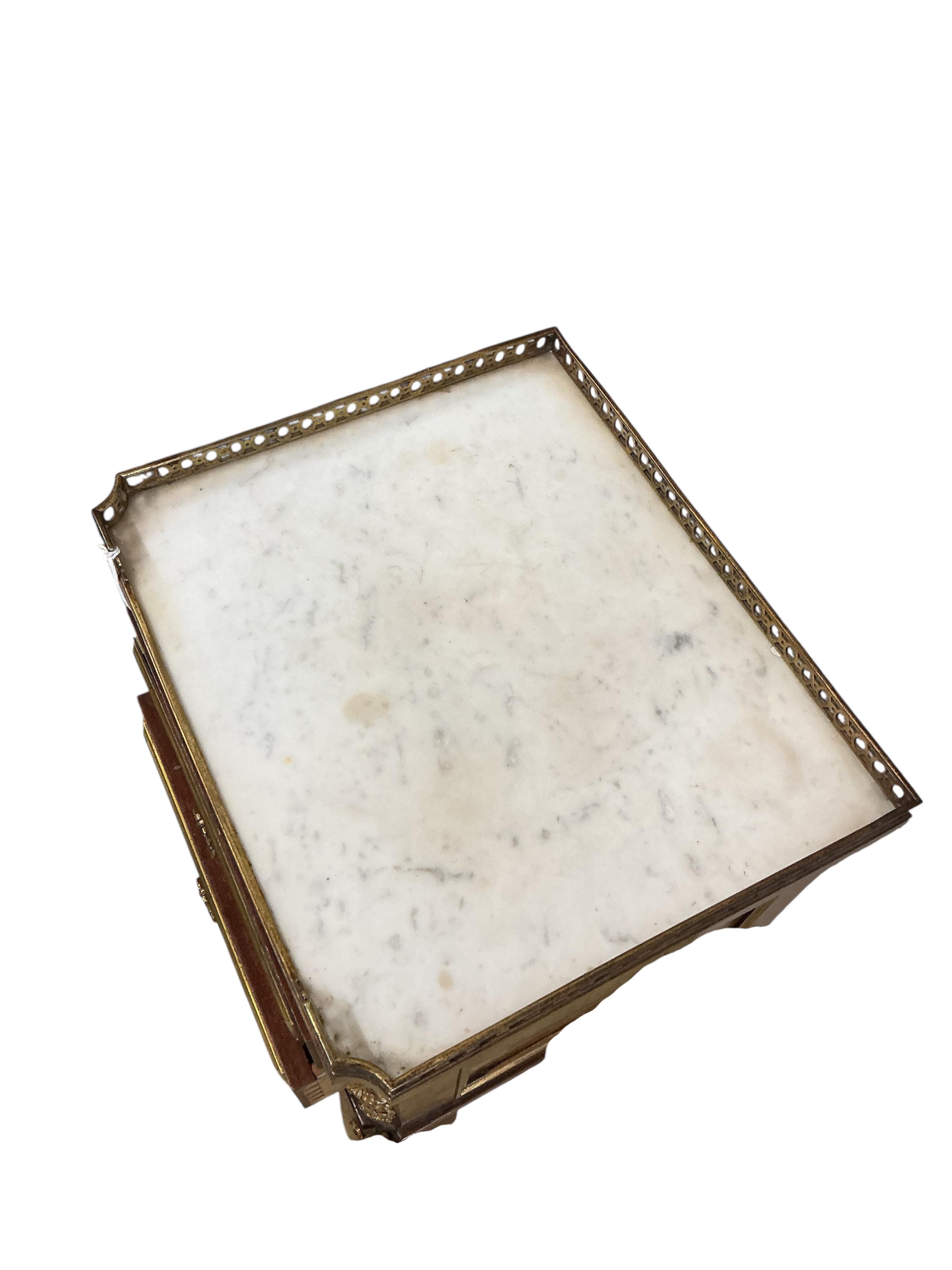 An early 20th century French gilt metal mounted marble topped mahogany bedside chest, width 37cm, depth 32cm, height 74cm